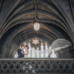 Newlyweds in front of window